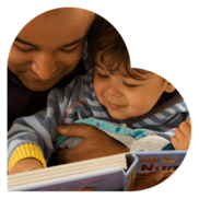 photo of adult reading with toddler