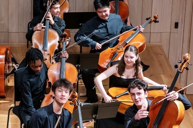 Young orchestra players relaxed and smiling