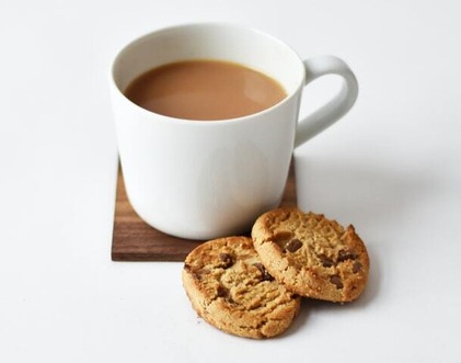 Coffee cup and biscuit