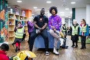 Children's author Nathan Bryon and illustrator Dapo Adeola pictured together in Manchester Central Children's Library