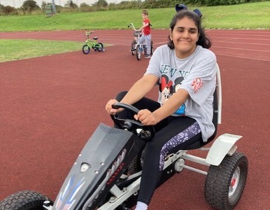 Girl on adapted bike