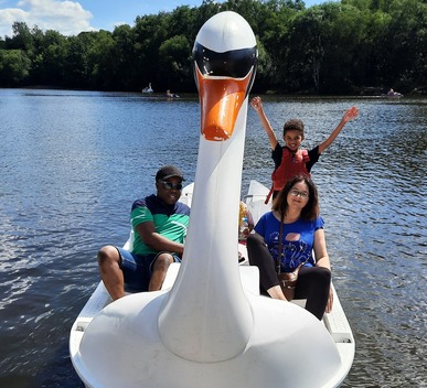 Family having fun in a swan boat