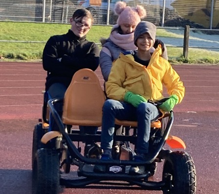 Family cycling on adapted bike