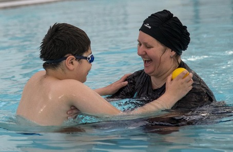 Mother and son swimming 