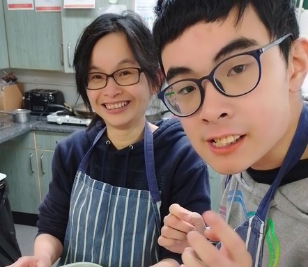 Two young people cooking 