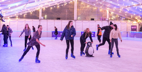 People skating at rink