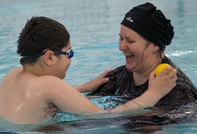 Mother and son swimming