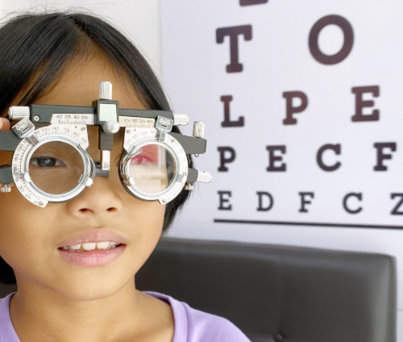 Young girl having eye test