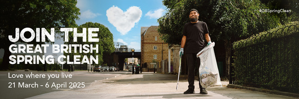 Great British Spring Clean. 21 March to 6 April. A man holding a litter picker and a bin bag on a street