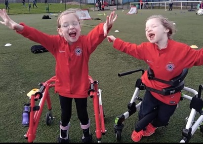 Two girls cerebral palsy football players 
