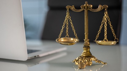 Legal scales by a laptop