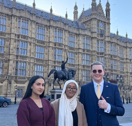 Three members of Youth Parliament standing outside Westminster