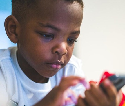 Young child with a mobile phone