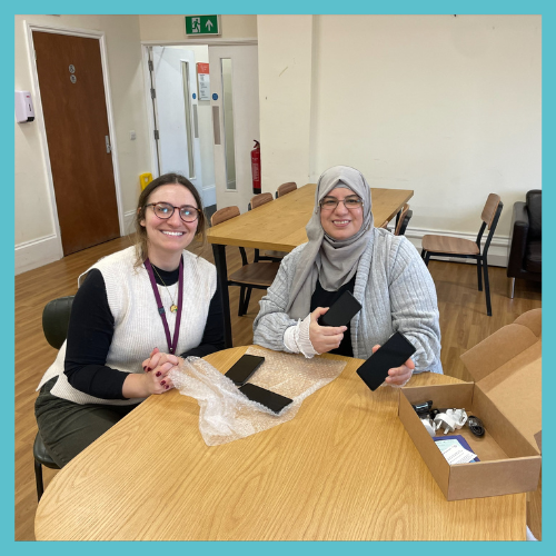Digital Inclusion Officer Emily with resident.