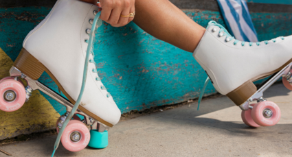 Person tying shoe lace on roller skate