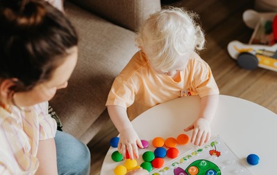 Young child playing with toy