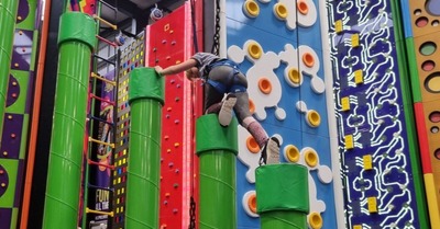 Boy climbing on equipment
