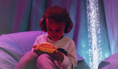 Child on a beanbag in a sensory space