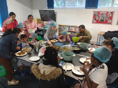 Families eating together at a large table