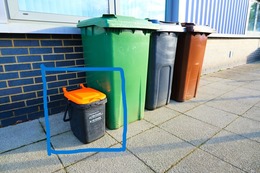row of wheeled bins