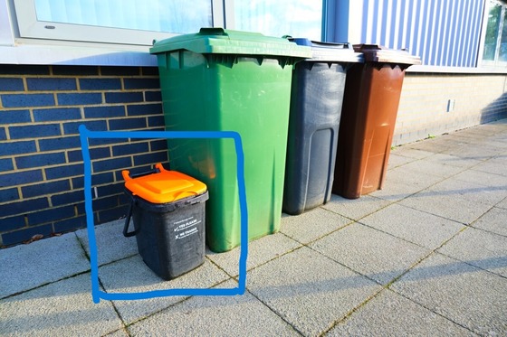 row of wheeled bins