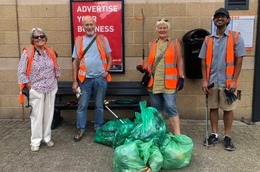 volunteers with bags of collected litter