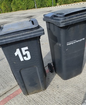 two black waste bins