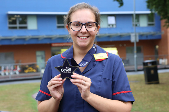 Eloise Brett proudly shows her award