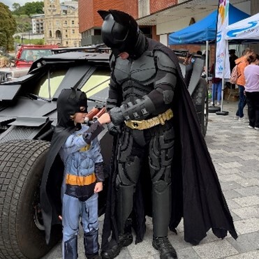 Child with Batman at Super Saturday