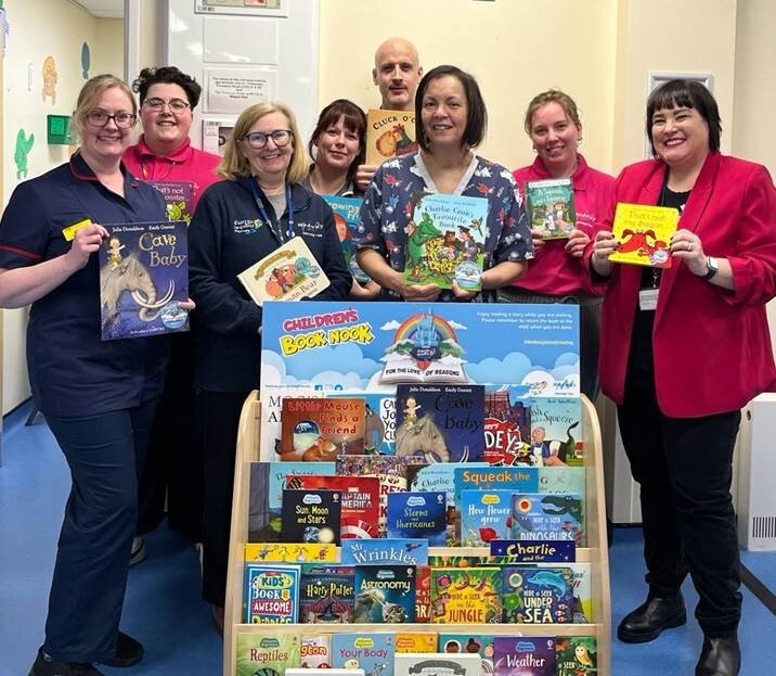 The Child-Friendly Medway team and Medway Maritime Hospital staff with a Book Nook