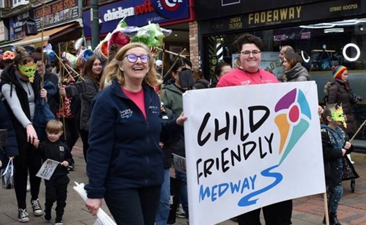Child-Friendly Medway Team in the Chinese New Year Parade with their banner flag
