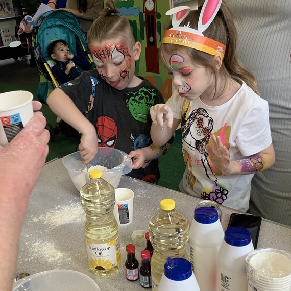Children taking part in a model dough making workshop. 
