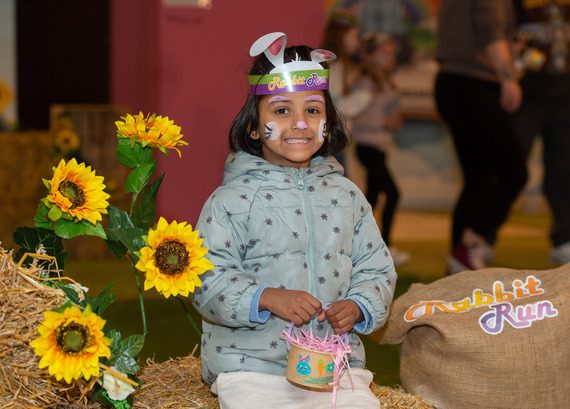 Child taking a photo after completing the Rabbit Run course. 