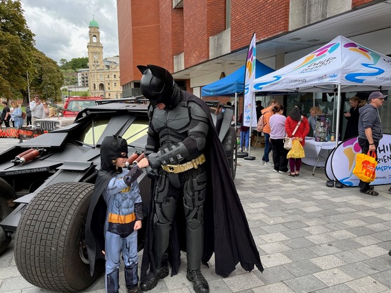 Batman and child at Super Saturday