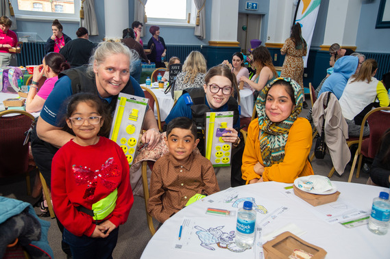 Kent Police with family at the Alice in Wonderland Women and Childrens Afternoon Tea Event.