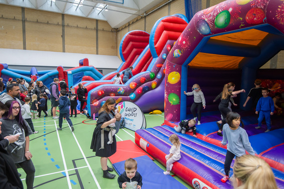 Families at Inflatable Fun Day.