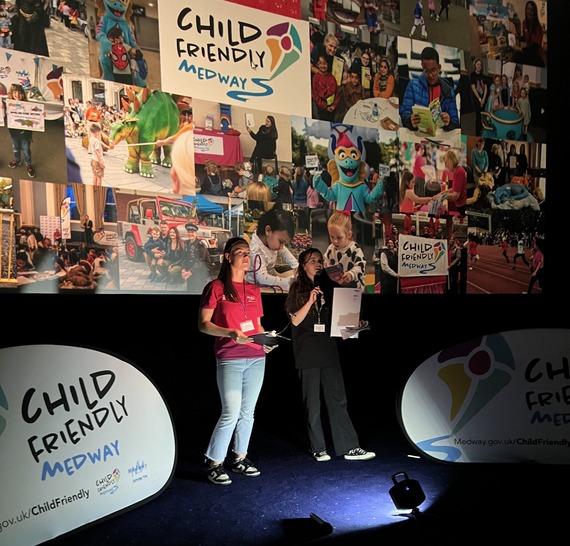 A member of the Child-Friendly Medway Team with a member of the Medway Adult Education Team, announcing winners to their activity