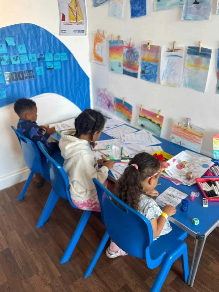 Children taking part in drawing activities at The Big Doodle