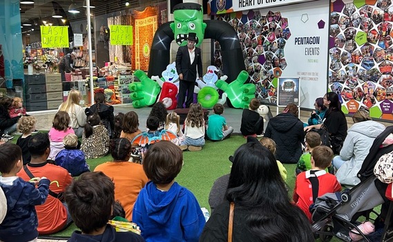 Families watching the 'Anton Ghoul' show at ScareFest