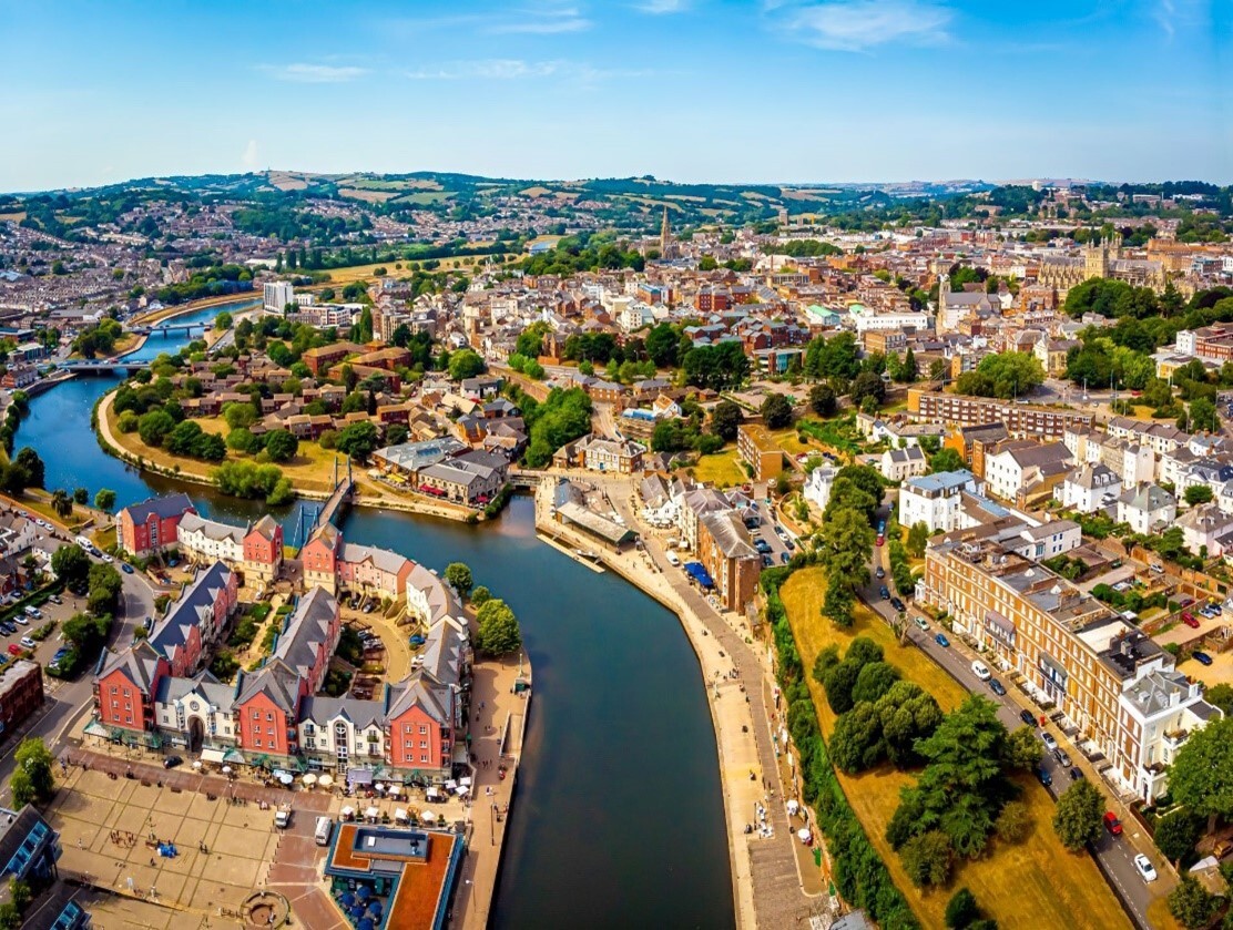 Ariel view of a town with a river running through it.