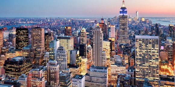 City skyline of New York showing many lit up skyscrapers