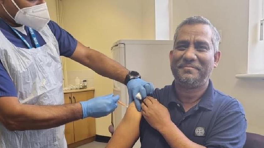 Deputy Mayor, Cllr Mohammed Khan receiving his first vaccine 