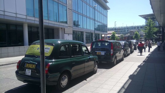 Taxis waiting at a taxi rank by Nottingham Station