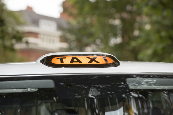 taxi sign on taxi