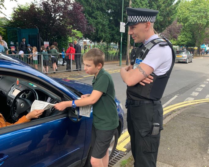 Senior Community Protection Officer educating waiting parents