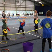 Children play tennis