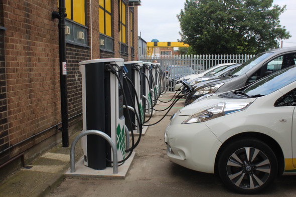 5 vehicles plugged into rapid chargers