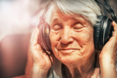 person with headphones on listening to a book