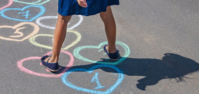 girl playing hopscotch