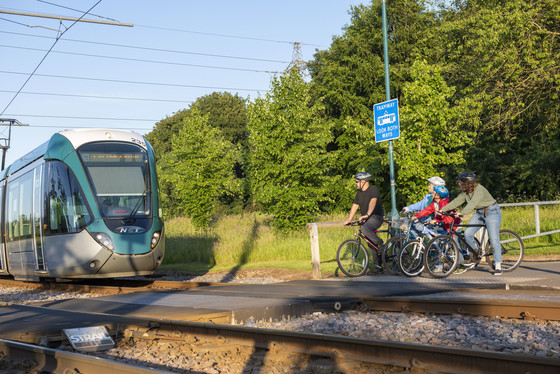 Cyclists and tram